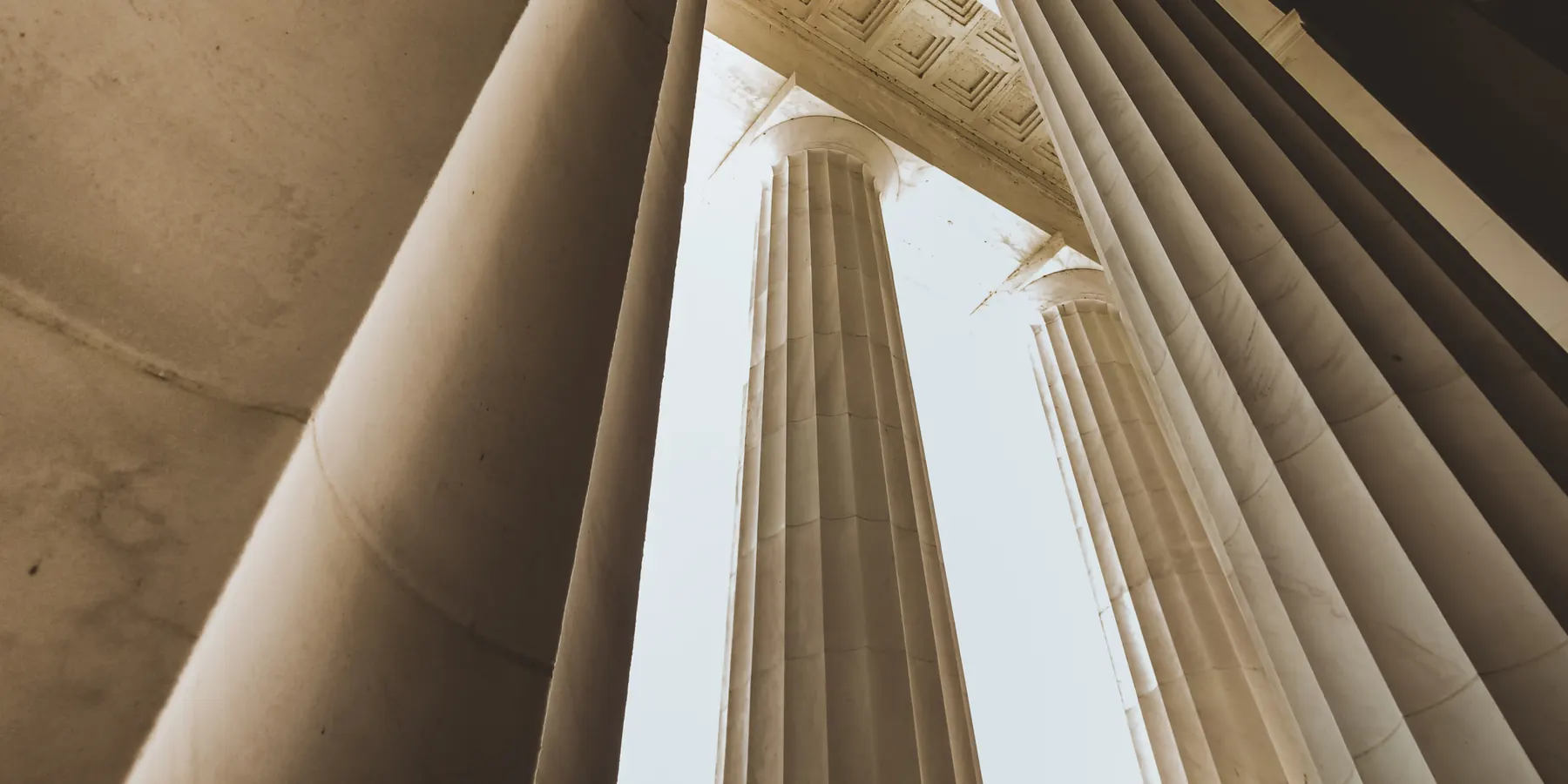Looking up between marble columns
